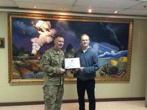 142 - Oliver receiving a gratitude plaque from the Base Commander in SW Asia