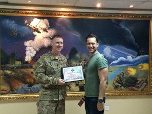 143 - Josh receiving a gratitude plaque from the Base Commander in SW Asia